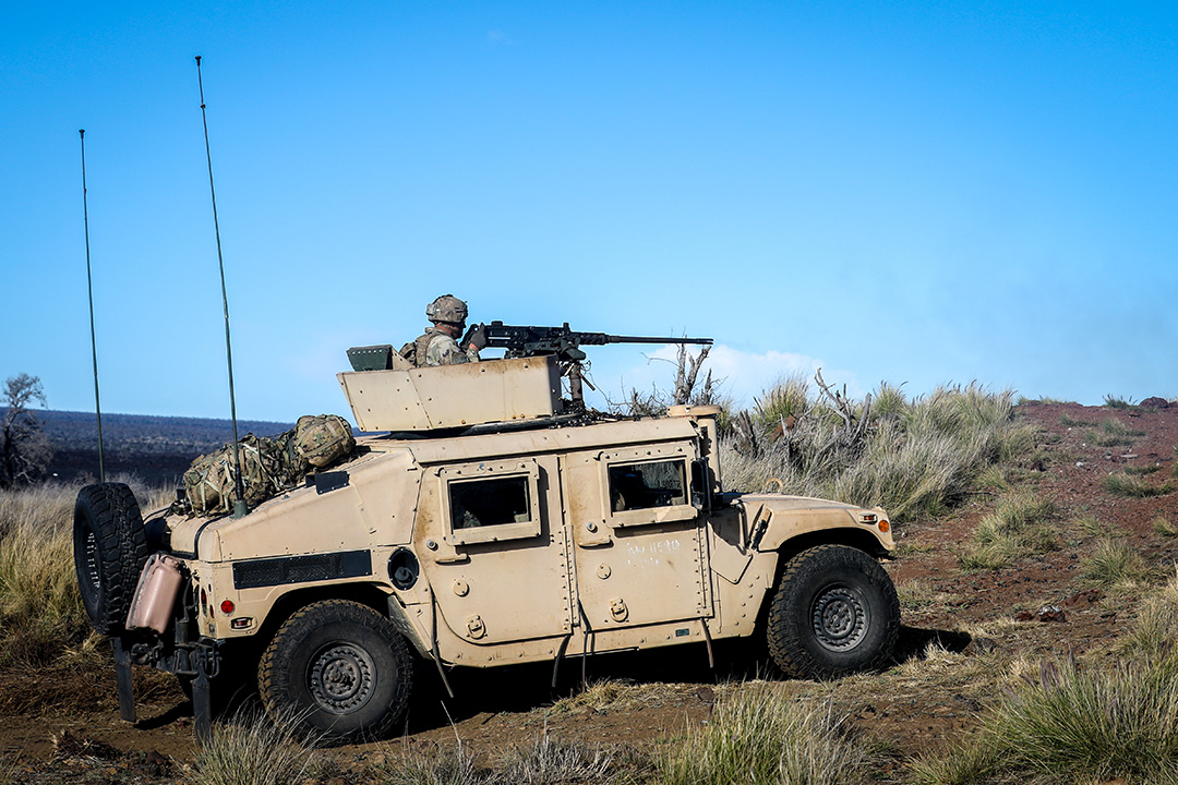 3/4 CAV Troopers conduct live-fire exercise during Operation Lightning Strike 2019 US Army Trooper rides as gunner in a M1151 Humvee during a live training drill in Hawaii