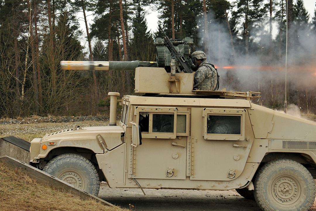 M1167-4 U.S. Marine firing a TOW Missile from M1167 Humvee