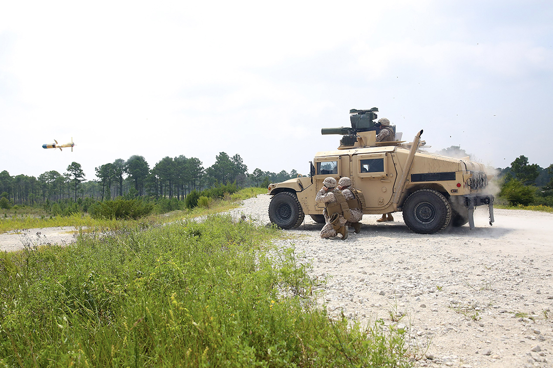 M1167-5 TOW Missile in mid-air after being fired from a launcher mounted to a M1167 Humvee