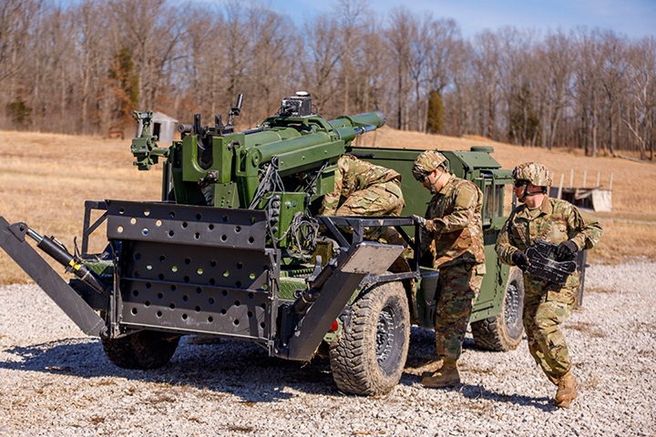 U.S. Military Personnel complete training exercises on an AM General Humvee Hawkeye, Mobile Howitzer